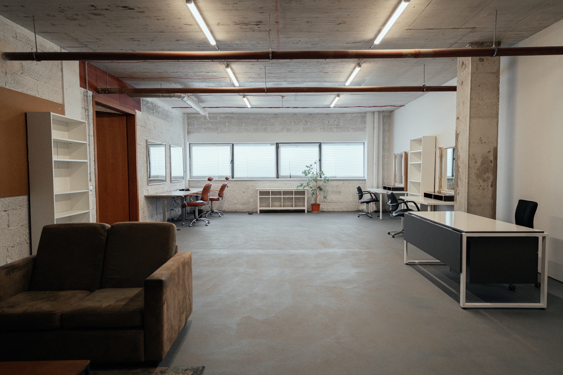 First floor make-up room with multiple stations and lounge area